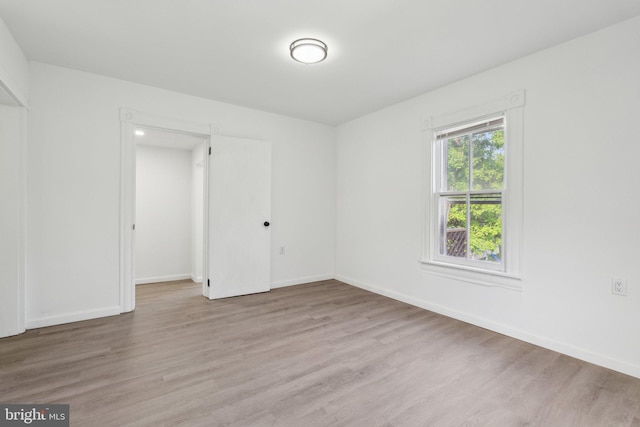 707 S Braddock St, Winchester, VA 22601 - empty room featuring light wood-style floors and baseboards