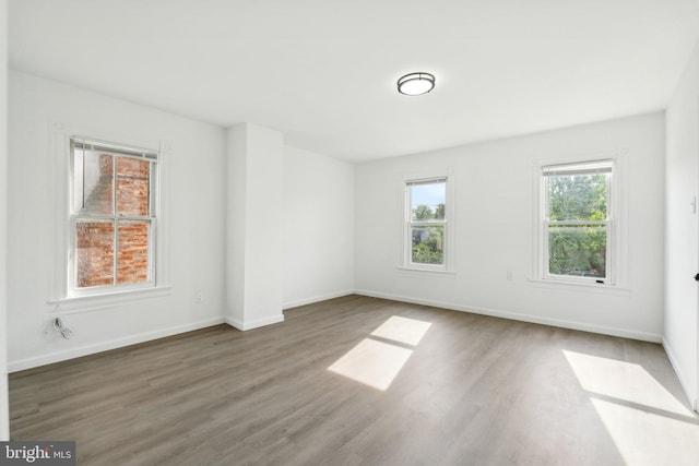 707 S Braddock St, Winchester, VA 22601 - empty room with wood finished floors and baseboards