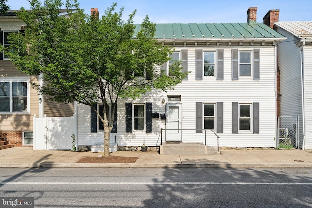 707 S Braddock St, Winchester, VA 22601 - view of front of property with a standing seam roof, metal roof, and a chimney