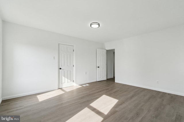 707 S Braddock St, Winchester, VA 22601 - spare room with wood finished floors and baseboards
