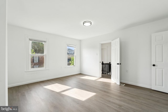 707 S Braddock St, Winchester, VA 22601 - empty room featuring wood finished floors and baseboards