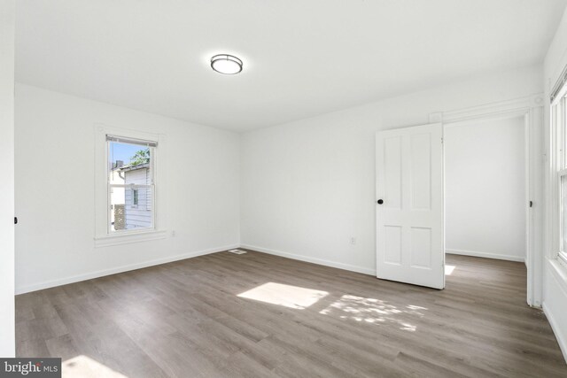 707 S Braddock St, Winchester, VA 22601 - unfurnished bedroom featuring wood finished floors and baseboards