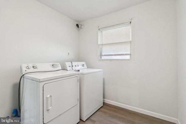 707 S Braddock St, Winchester, VA 22601 - laundry area featuring washing machine and dryer, light wood finished floors, and baseboards