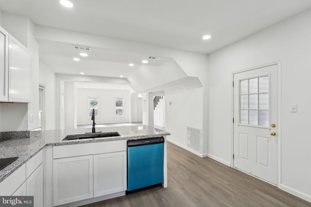 707 S Braddock St, Winchester, VA 22601 - kitchen featuring a sink, dishwasher, white cabinetry, wood finished floors, and light stone counters