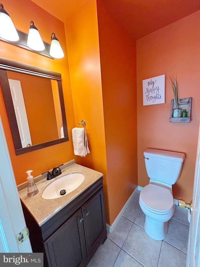 3603 Regency Dr, Reading, PA 19608 - half bath featuring vanity, toilet, tile patterned flooring, and baseboards