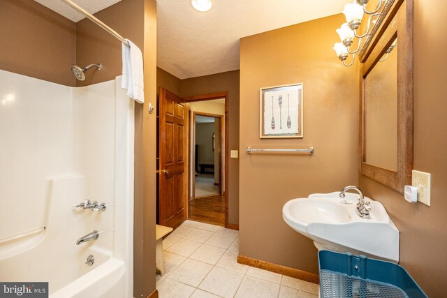 285 Cherry Heights Ln, Mc Henry, MD 21541 - full bathroom with a chandelier, tile patterned flooring, shower / bathtub combination, baseboards, and a textured ceiling