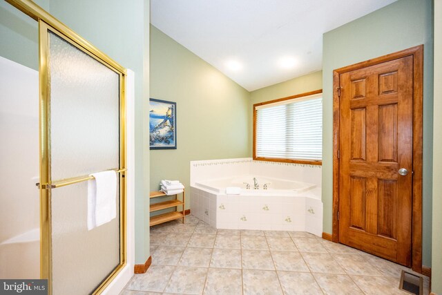285 Cherry Heights Ln, Mc Henry, MD 21541 - bathroom with lofted ceiling, a shower stall, a bath, and tile patterned flooring