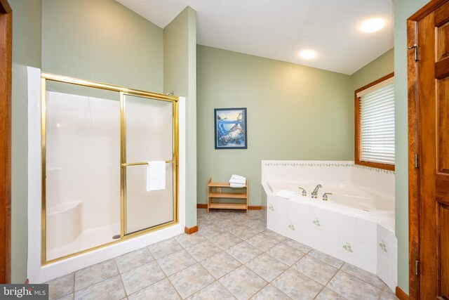 285 Cherry Heights Ln, Mc Henry, MD 21541 - bathroom with a stall shower, a garden tub, tile patterned flooring, lofted ceiling, and baseboards