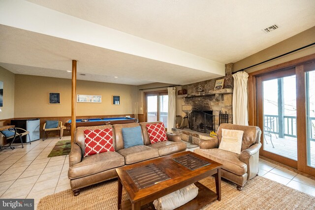 285 Cherry Heights Ln, Mc Henry, MD 21541 - living room with light tile patterned floors, billiards table, and a stone fireplace