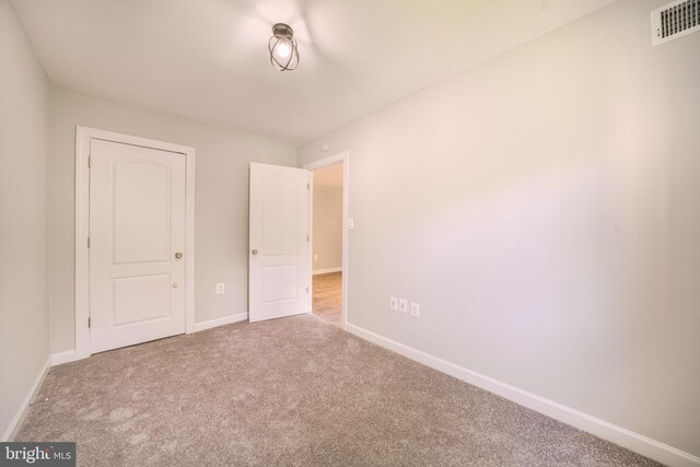 6305 Hil Mar Dr Unit 2-9, District Heights, MD 20747 - unfurnished bedroom featuring baseboards and carpet