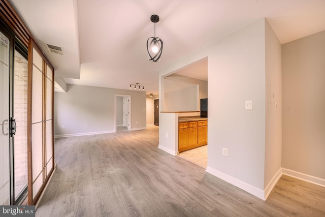 6305 Hil Mar Dr Unit 2-9, District Heights, MD 20747 - unfurnished living room featuring light wood-style floors and baseboards