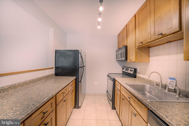 6305 Hil Mar Dr Unit 2-9, District Heights, MD 20747 - kitchen with stainless steel appliances, a sink, backsplash, light tile patterned floors, and dark countertops