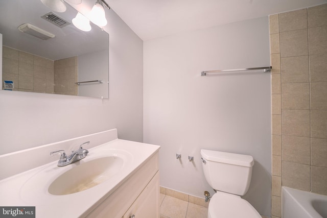 6305 Hil Mar Dr Unit 2-9, District Heights, MD 20747 - bathroom with tile patterned flooring, toilet, vanity, and baseboards