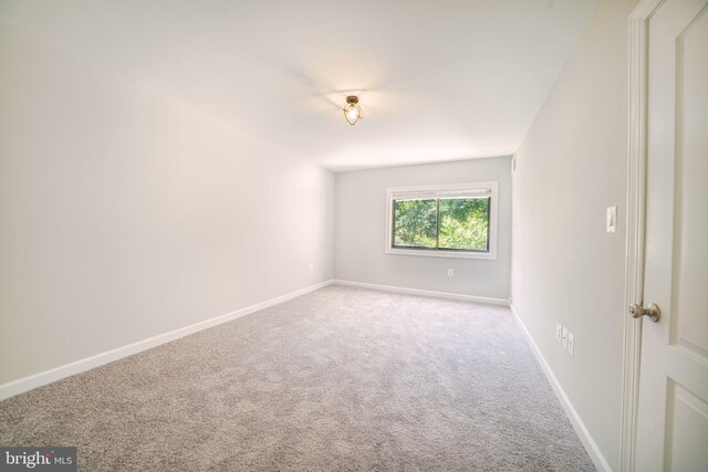 6305 Hil Mar Dr Unit 2-9, District Heights, MD 20747 - spare room featuring carpet and baseboards