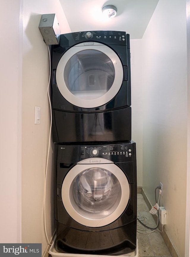 6305 Hil Mar Dr Unit 2-9, District Heights, MD 20747 - clothes washing area with stacked washer and clothes dryer and baseboards