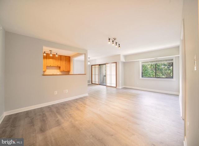 6305 Hil Mar Dr Unit 2-9, District Heights, MD 20747 - unfurnished living room with track lighting, wood finished floors, and baseboards