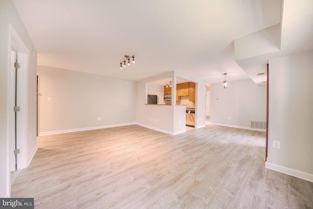 6305 Hil Mar Dr Unit 2-9, District Heights, MD 20747 - unfurnished living room featuring light wood finished floors and baseboards