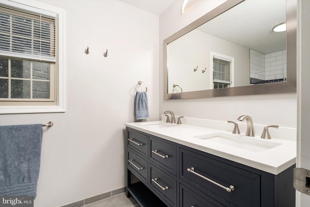 bathroom featuring double vanity and tile patterned flooring