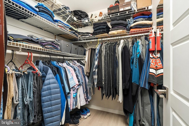 spacious closet with wood finished floors