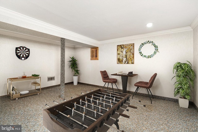 dining area featuring crown molding and baseboards