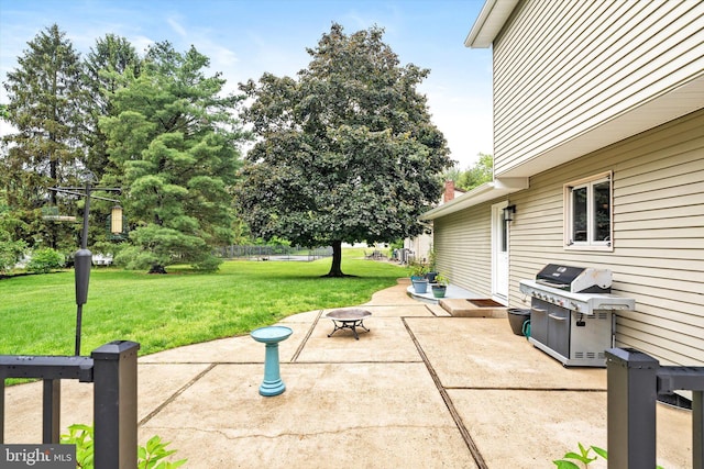 view of patio with a grill