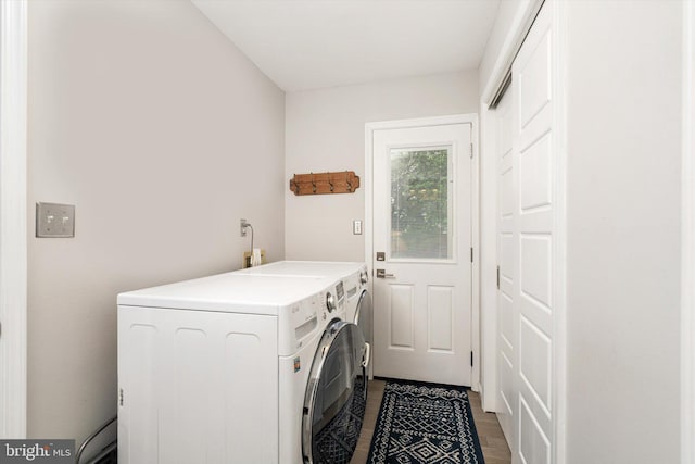 laundry area with independent washer and dryer