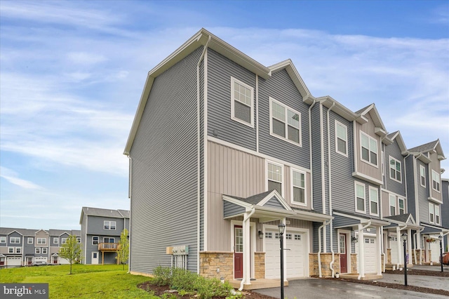 112 Veery Way, Port Matilda, PA 16870 - view of front facade with an attached garage, a residential view, and driveway