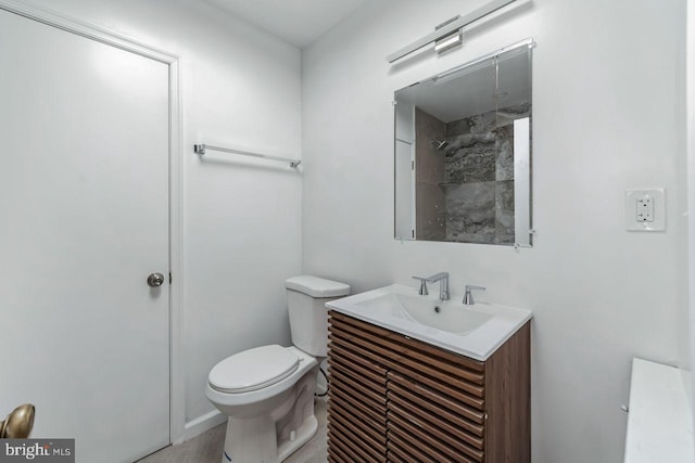 bathroom with toilet and vanity
