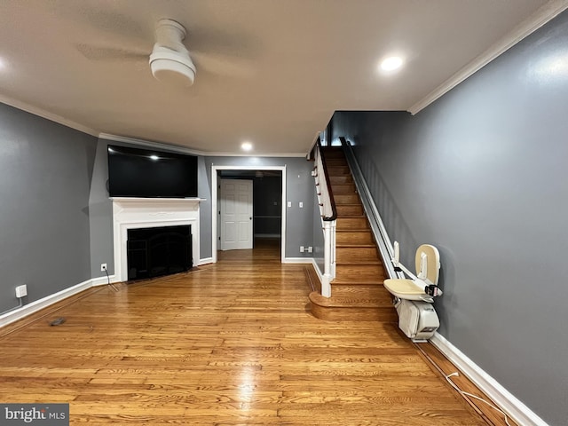 2322 79th Ave, Philadelphia, PA 19150 - unfurnished living room featuring crown molding, stairway, light wood-style flooring, a fireplace, and recessed lighting
