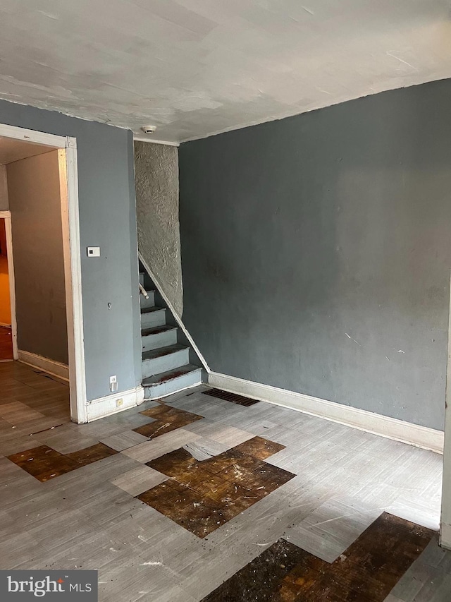 2918 N Taylor St, Philadelphia, PA 19132 - empty room featuring wood finished floors, stairway, and baseboards