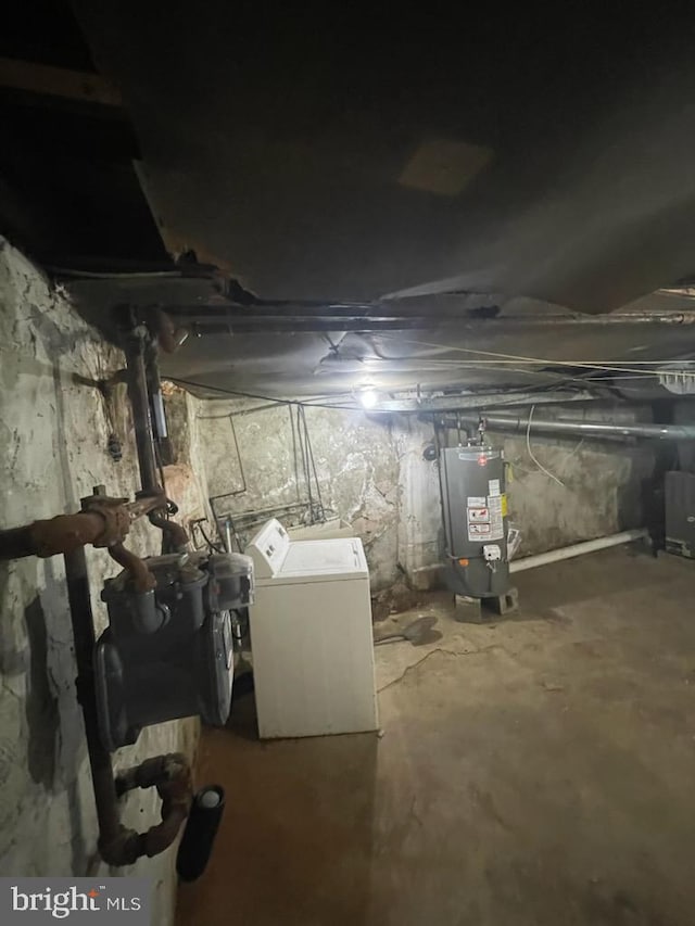 2918 N Taylor St, Philadelphia, PA 19132 - unfinished basement featuring water heater and washing machine and clothes dryer