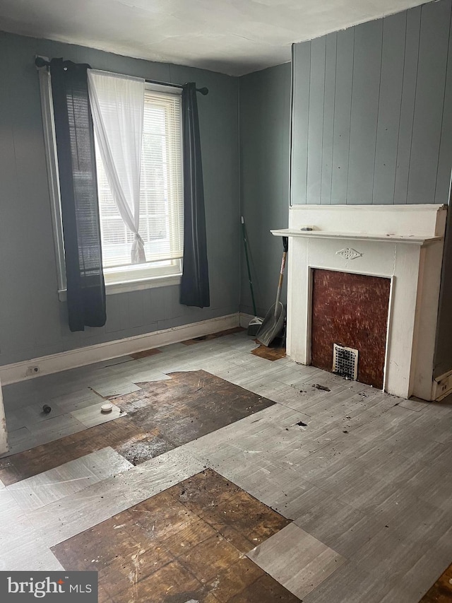 2918 N Taylor St, Philadelphia, PA 19132 - unfurnished living room featuring baseboards and wood finished floors