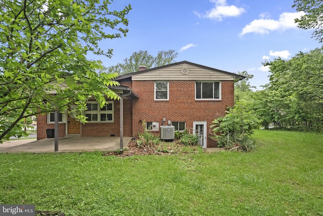 13111 Valleywood Dr, Silver Spring, MD 20906 - rear view of property featuring cooling unit, brick siding, a patio area, a lawn, and a chimney