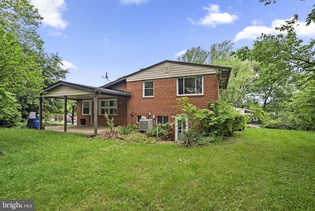 13111 Valleywood Dr, Silver Spring, MD 20906 - back of house with brick siding, a yard, central AC, and a patio area