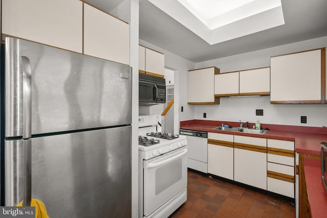 13111 Valleywood Dr, Silver Spring, MD 20906 - kitchen with white appliances, a sink, and white cabinets