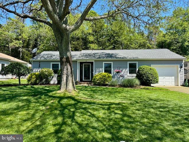 16 Bayberry Dr, Lanoka Harbor, NJ 08734 - single story home with an attached garage, a front lawn, and driveway