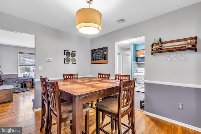 16 Bayberry Dr, Lanoka Harbor, NJ 08734 - dining area with light wood-type flooring and baseboards