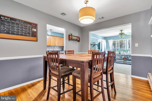 16 Bayberry Dr, Lanoka Harbor, NJ 08734 - dining room featuring light wood-style floors, baseboards, and ceiling fan