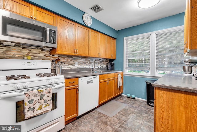 16 Bayberry Dr, Lanoka Harbor, NJ 08734 - kitchen with white appliances, a sink, decorative backsplash, baseboards, and dark countertops