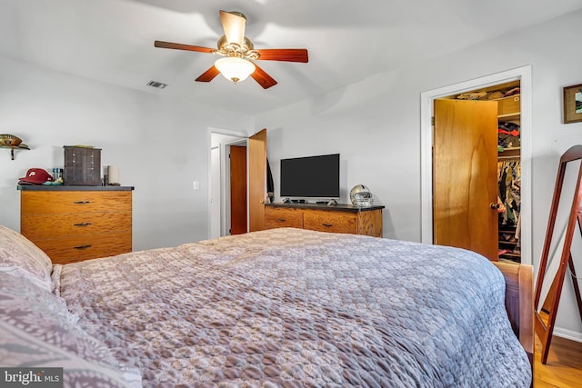 16 Bayberry Dr, Lanoka Harbor, NJ 08734 - bedroom featuring a spacious closet, wood finished floors, a closet, and ceiling fan