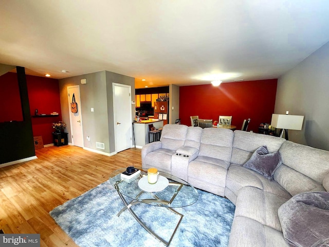 36 Lauren Ct, Levittown, PA 19057 - living room featuring light wood finished floors and baseboards