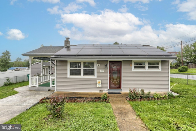 337 W Perry St, Enola, PA 17025 - bungalow-style home featuring solar panels and a chimney