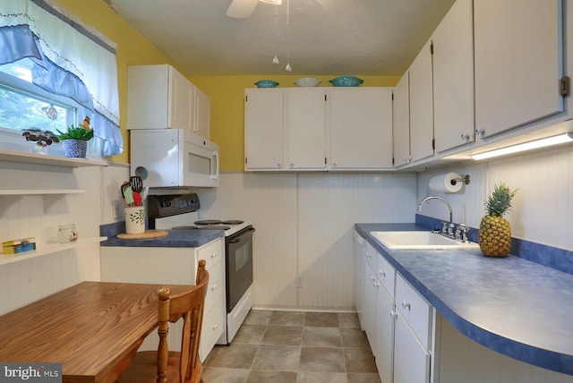 337 W Perry St, Enola, PA 17025 - kitchen with white appliances, white cabinets, a sink, ceiling fan, and dark countertops