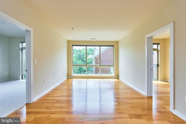 2200 N Westmoreland St Unit 325, Arlington, VA 22213 - unfurnished room featuring light wood-style floors and a pendent fire sprinkler