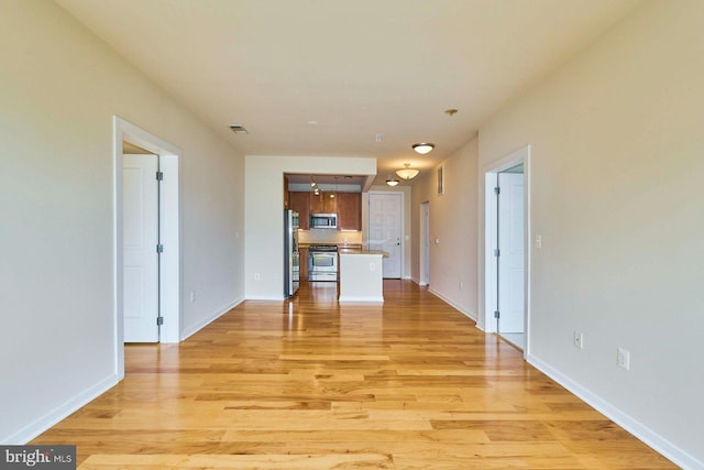 2200 N Westmoreland St Unit 325, Arlington, VA 22213 - unfurnished living room with light wood-style flooring