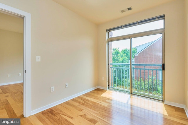 2200 N Westmoreland St Unit 325, Arlington, VA 22213 - empty room with light wood finished floors and baseboards