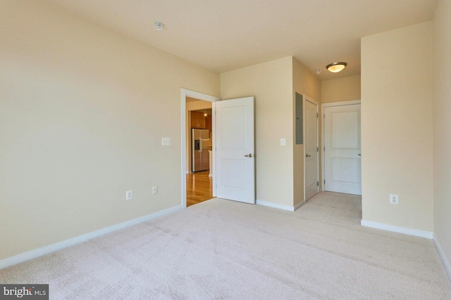 2200 N Westmoreland St Unit 325, Arlington, VA 22213 - unfurnished bedroom with stainless steel fridge and light carpet