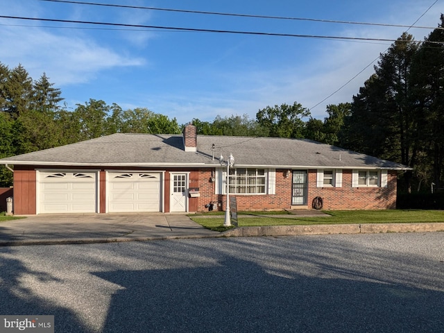 671 Woodview St, Steelton, PA 17113 - single story home featuring driveway, an attached garage, a chimney, brick siding, and a front lawn