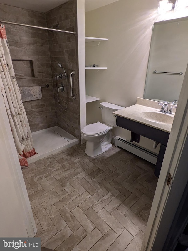 671 Woodview St, Steelton, PA 17113 - bathroom featuring a baseboard radiator, a tile shower, toilet, and vanity