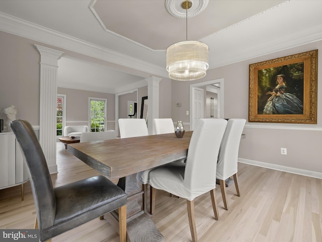 720 Cyprian Ct, Gambrills, MD 21054 - dining area with ornate columns, light wood-type flooring, a chandelier, and ornamental molding
